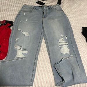 Straight leg ripped jeans , never worn!